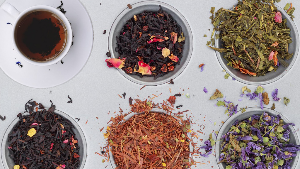 variety of teas in a bowls and tea cup image
